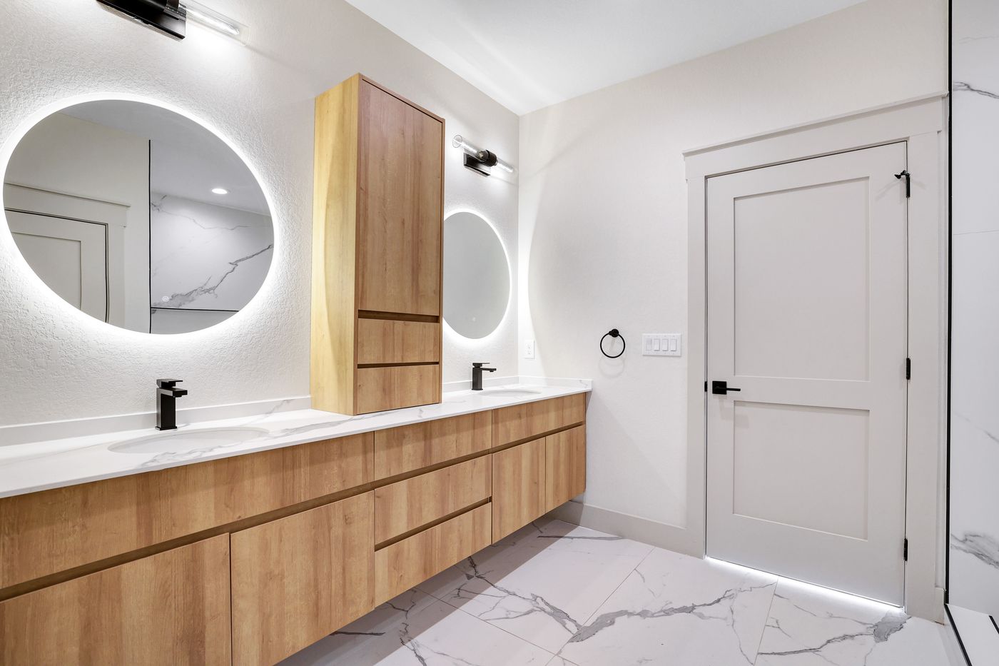 Custom kitchen with cabinetry and designer lighting